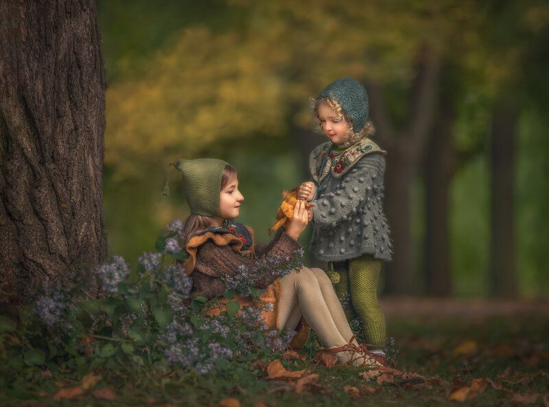 "Children captured during a fall forest adventure, exploring the vibrant autumn woods in a playful outdoor portrait session in Ottawa."