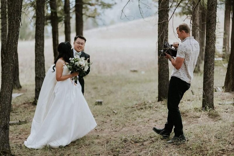 Matt filming a couple on their wedding day in Banff national park