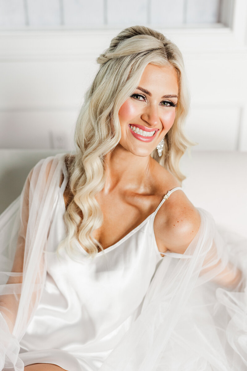 a bride smiling on her wedding day