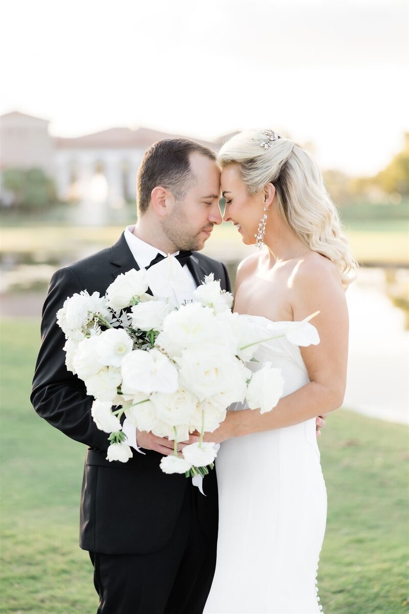 Bride and Groom Portrait on a golf course at the Country Club of Orlando by Orlando wedding photographer