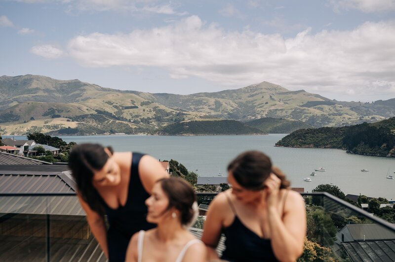 a spectacular view of mountains and ocean from a wedding venue in akaroa new zealand