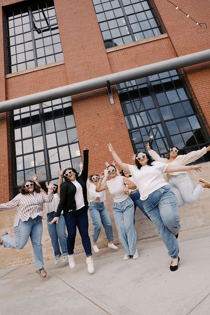 Raleigh event planners dancing and smiling