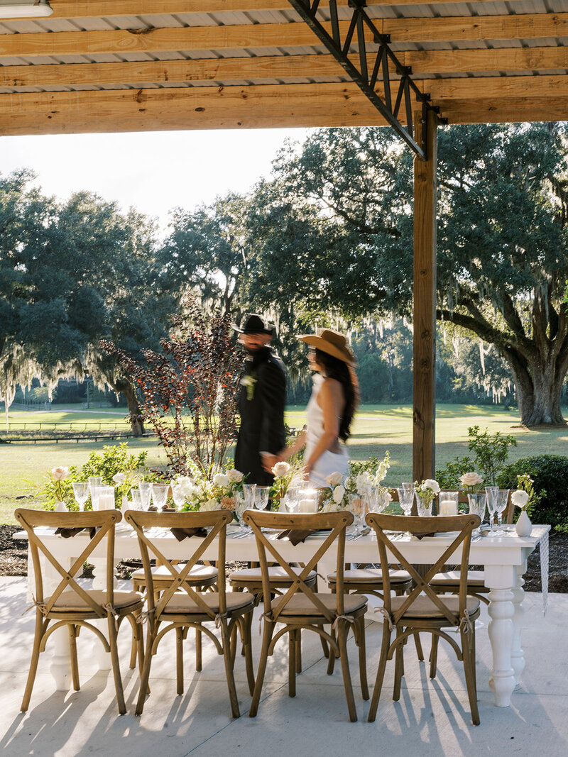 bride and groom drinking champagne in the back of a limo
