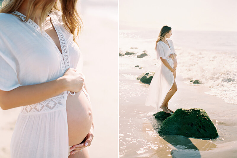 A mom cradling her baby bump while looking out at the ocean in Santa Barbara