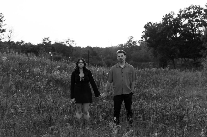 Black and White Serious Couples Photo in a field 