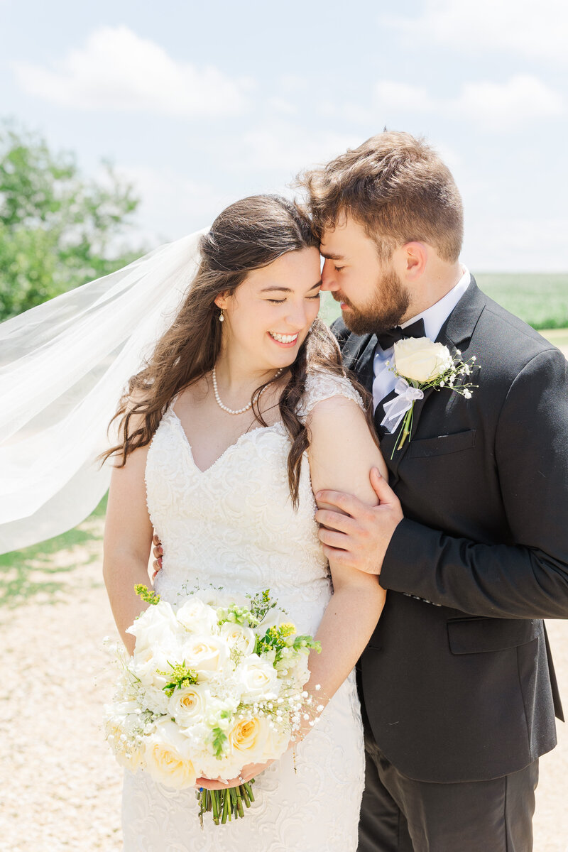bride and groom embracing on their wedding day