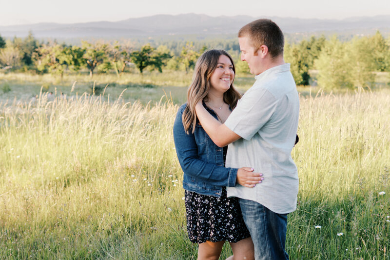 Romantic couple's portrait in a golden field during a natural light photography session near Portland, OR