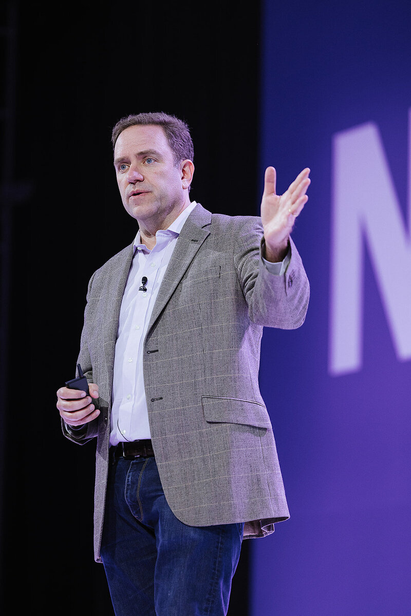 man on stage as a the key note speaker 