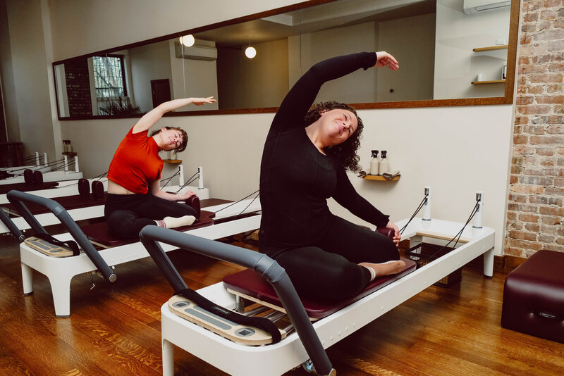 2 clients in the signature All Level class at Craft Pilates
