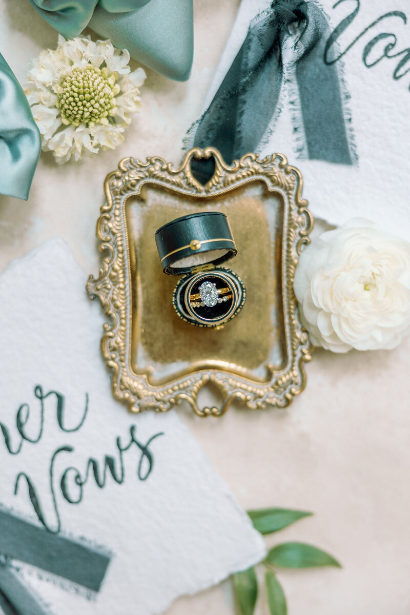 charming vintage box, the engagement ring gleams with timeless elegance, a symbol of love and commitment. As a Georgia wedding photographer, I adore capturing the intricate beauty of these precious details.