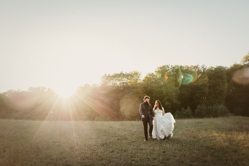 Bride and Groom Portrait in the fields of Caribou Bay Resort in Coloma, Wisconsin. Taken By Cree La Vie Studios.