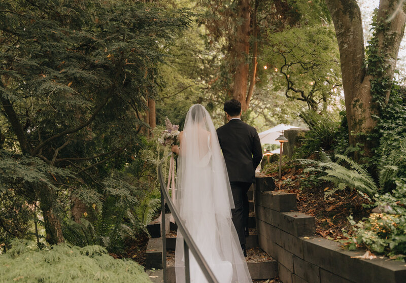 couple walking up stairs at jm cellars wedding
