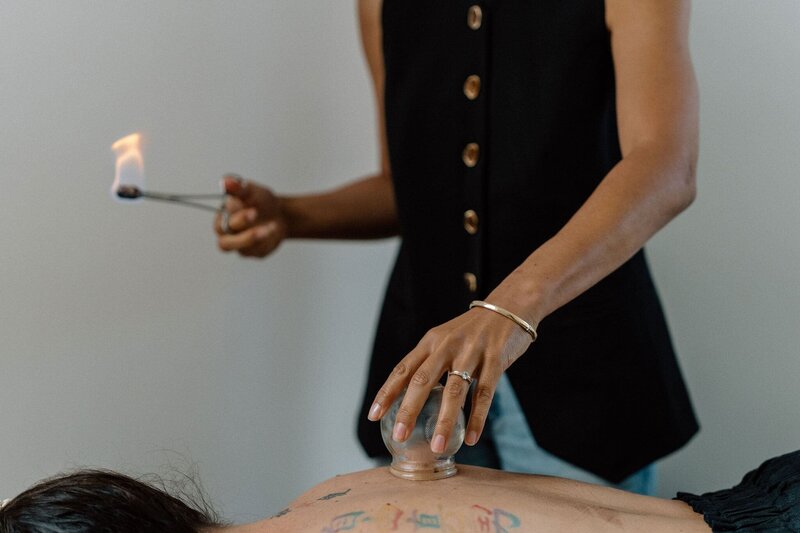 Acupuncture and lady with cupping