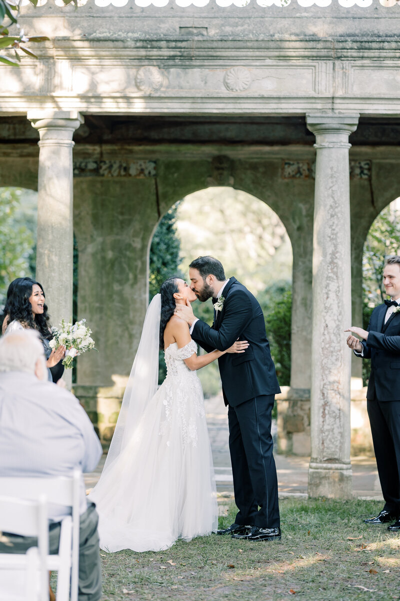 Luxury Wedding Photographer Atlanta | Bride And Groom Kissing At Garden Wedding Ceremony At Virginia House