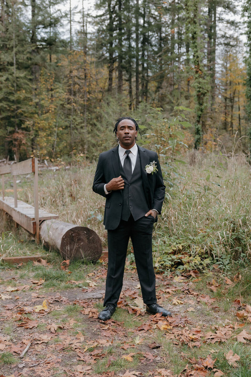 Groom standing outdoors