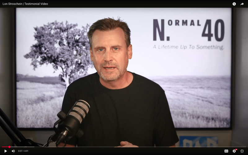 Chuck Shaver sharing his Vintage One testimonial on video at a Normal 40 in-person mastermind event