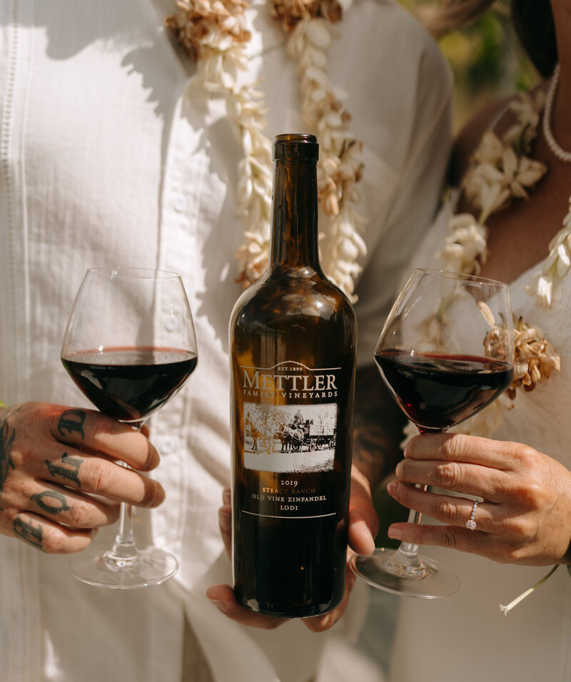 A breathtaking destination wedding in Bora Bora, where elegantly set wine glasses reflect the beauty of the island’s tropical paradise and luxury setting.