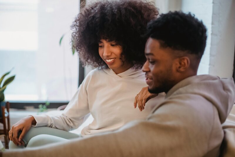 Man and woman sitting together smiling