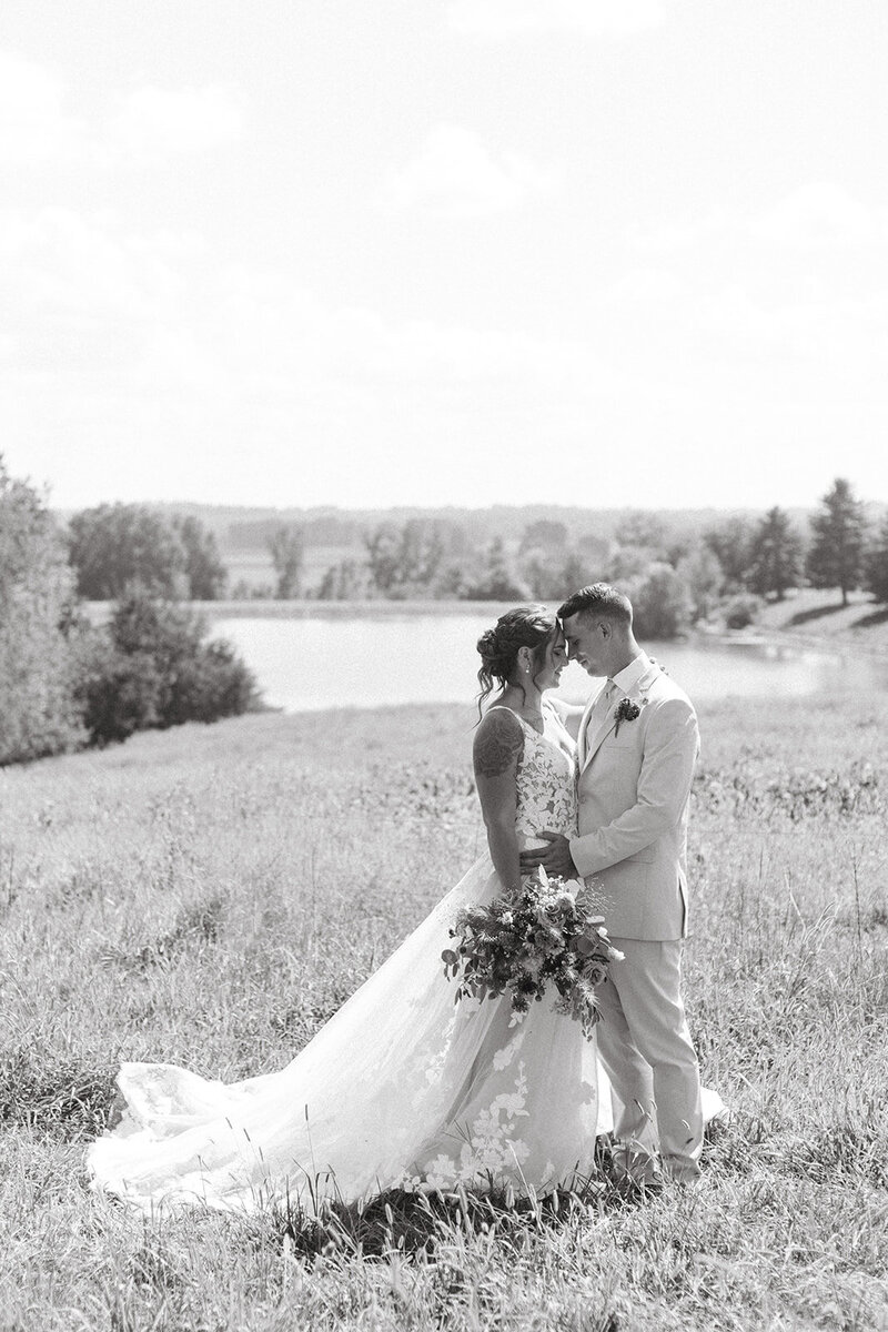 bride and groom embrace St. Louis Wedding Photographers