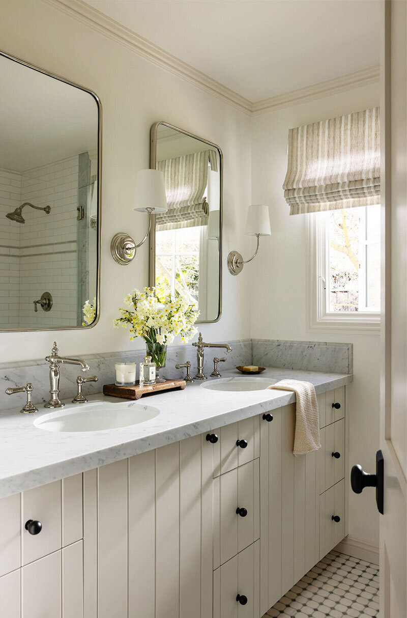 Marble countertops and warm interiors in a classically styled Walnut Creek bathroom
