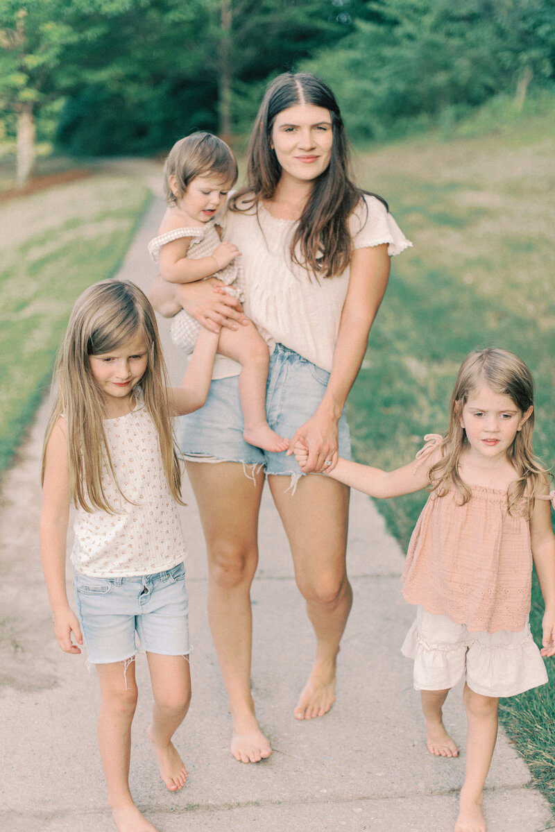 Olivia J. Morgan wedding and family photographer walking with her daughters in Birmingham, AL