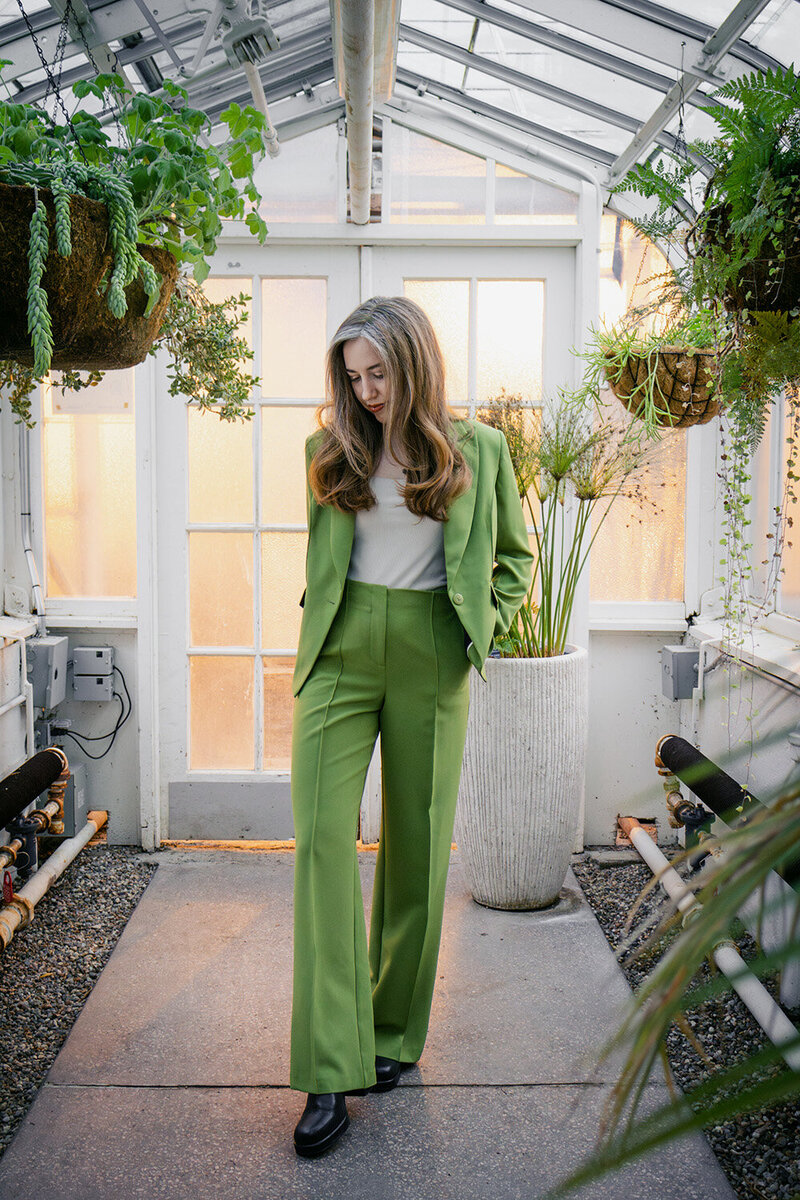 Content repurposing strategist standing in a greenhouse
