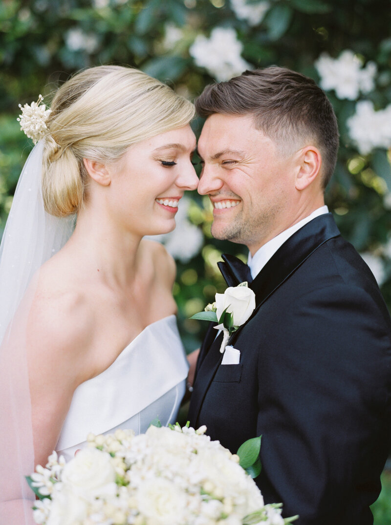 modern bride and groom with bride wearing her Grandma's 1950's vintage heirloom wax flower bridal crown restyled into modern hair comb