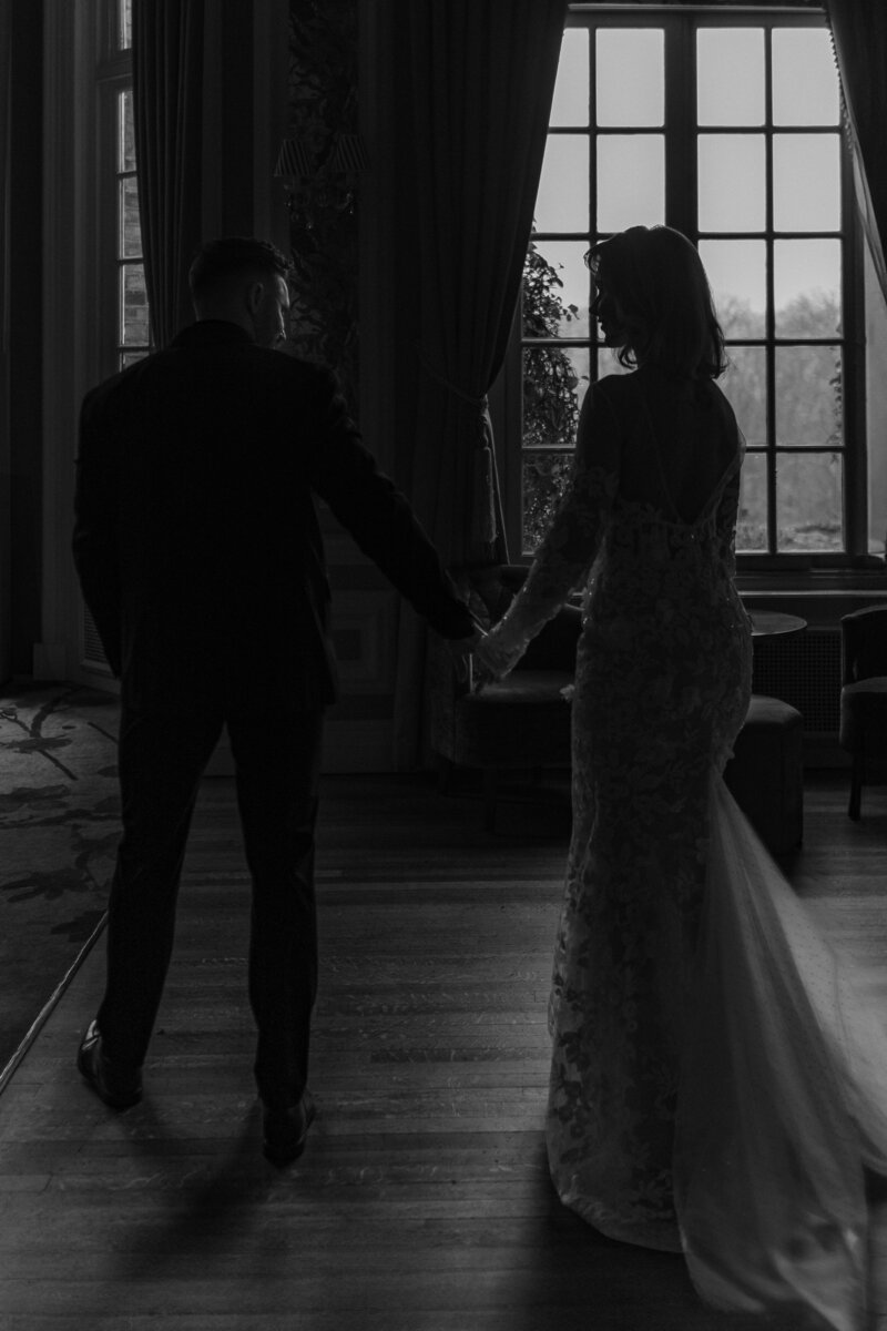 A wedding photographer captures the magical moment of a bride and groom celebrating their wedding ceremony as the bride throws the bouquet in the air