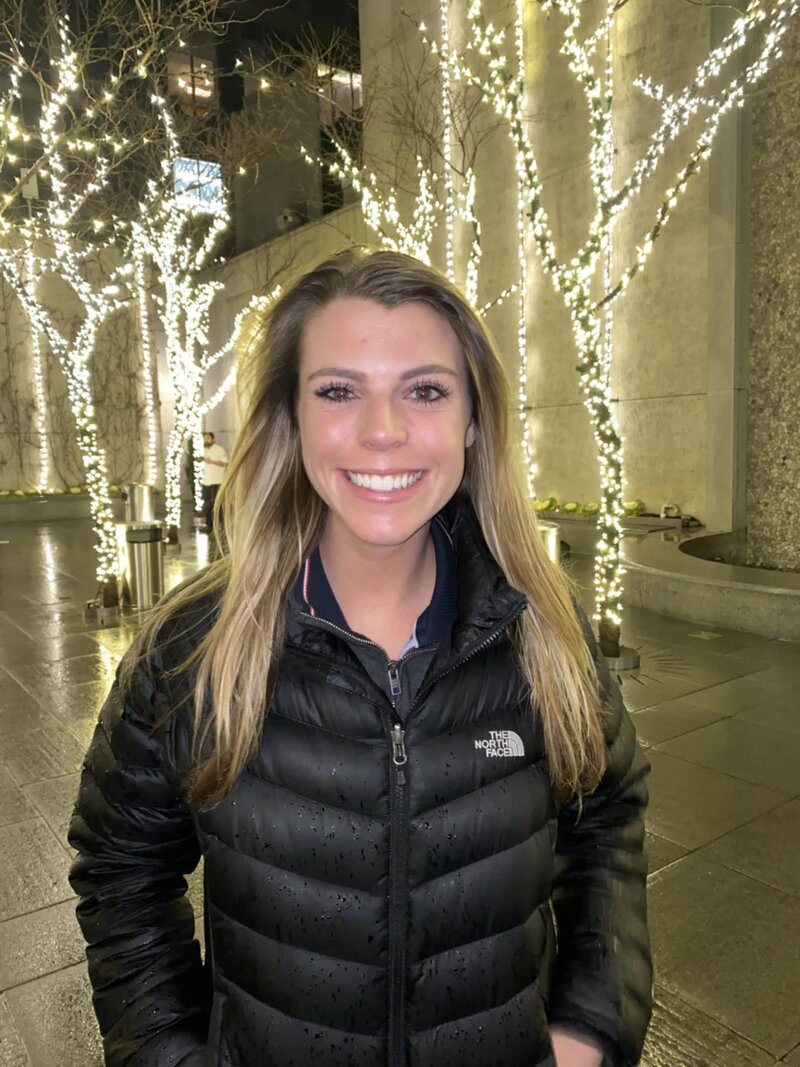 Maddie McGrath, front desk patient coordinator at Wellness and Hormone Health in Centennial Colorado, welcoming patients and assisting with appointments