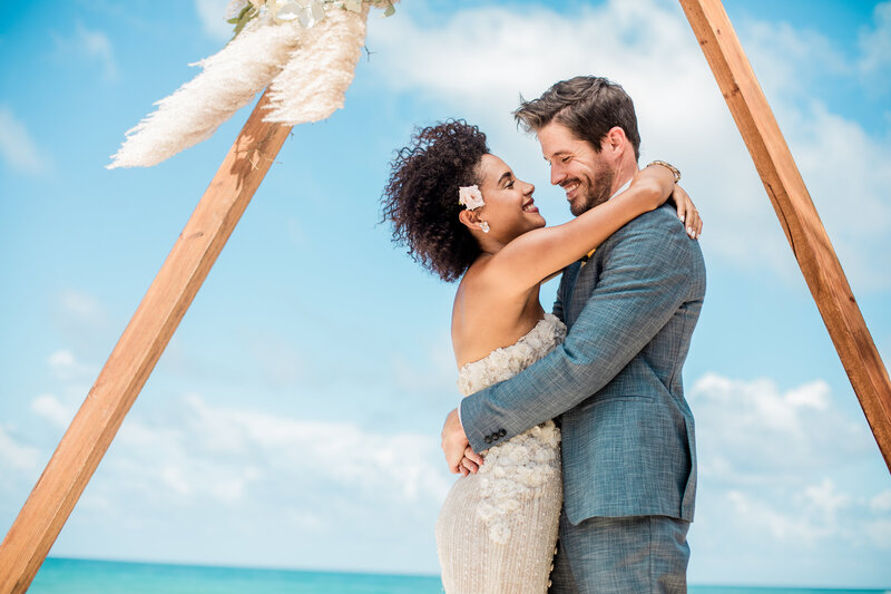 Romantic beachside destination wedding in Mexico with boho florals