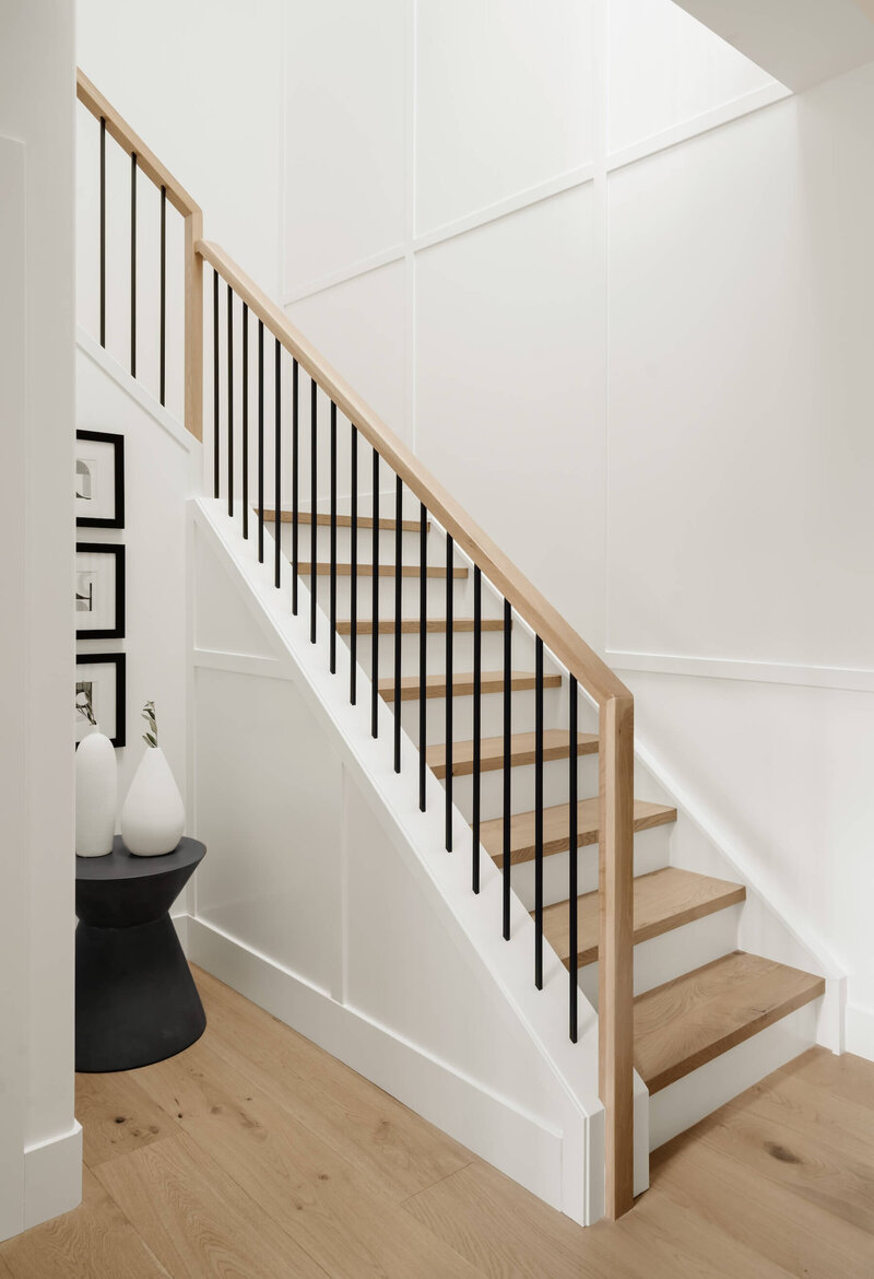 White oak staircase, millwork detail and black spindles. 