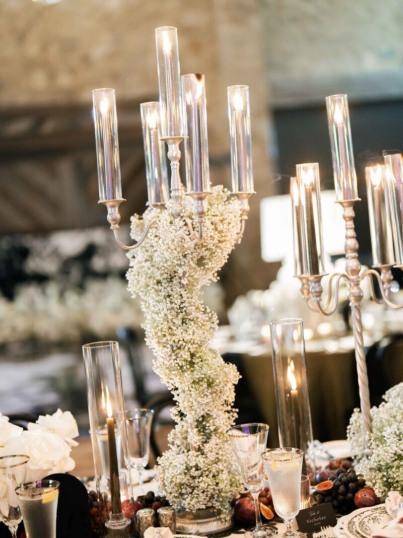A candelabra with babies breath