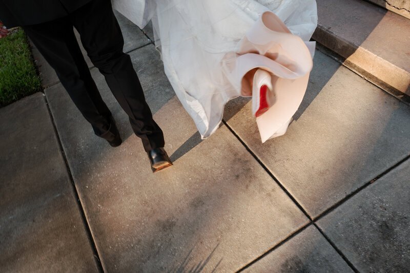bride and groom running image by film wedding photographers Noble Photo Co