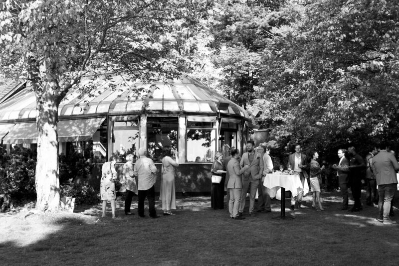 wedding guests standing outside the teahouse in stanley park