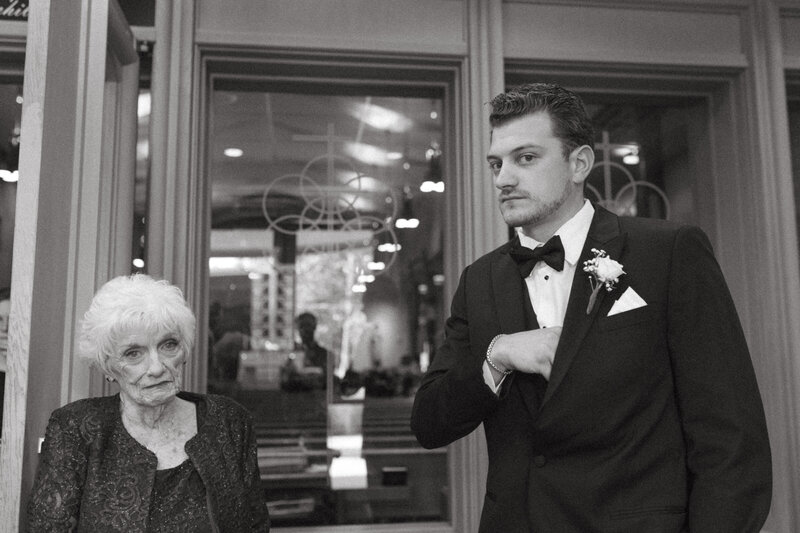Timeless black and white image of couple holding hands in a quiet moment