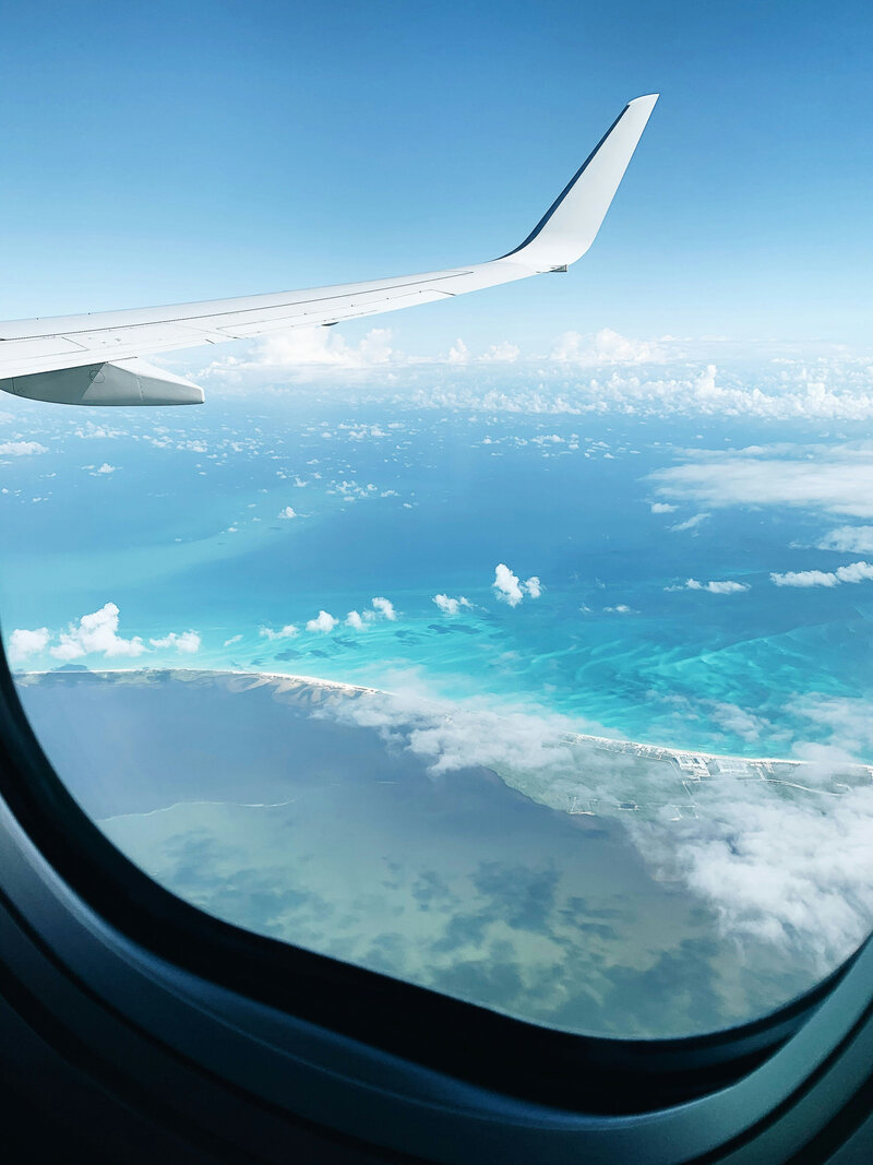 flying over the ocean from a plane window