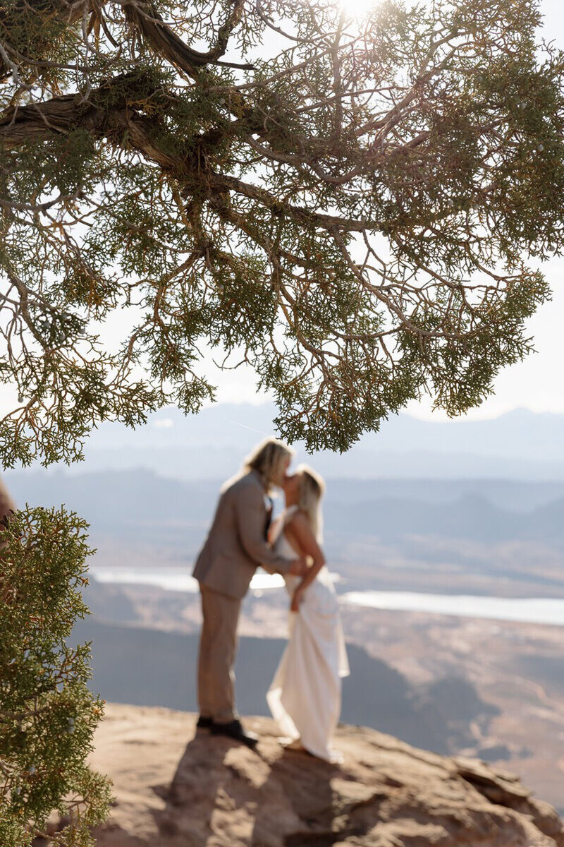 Eloping under a tree in Utah, taken by one of the best Moab elopement photographers, Forever Framed by Rachel
