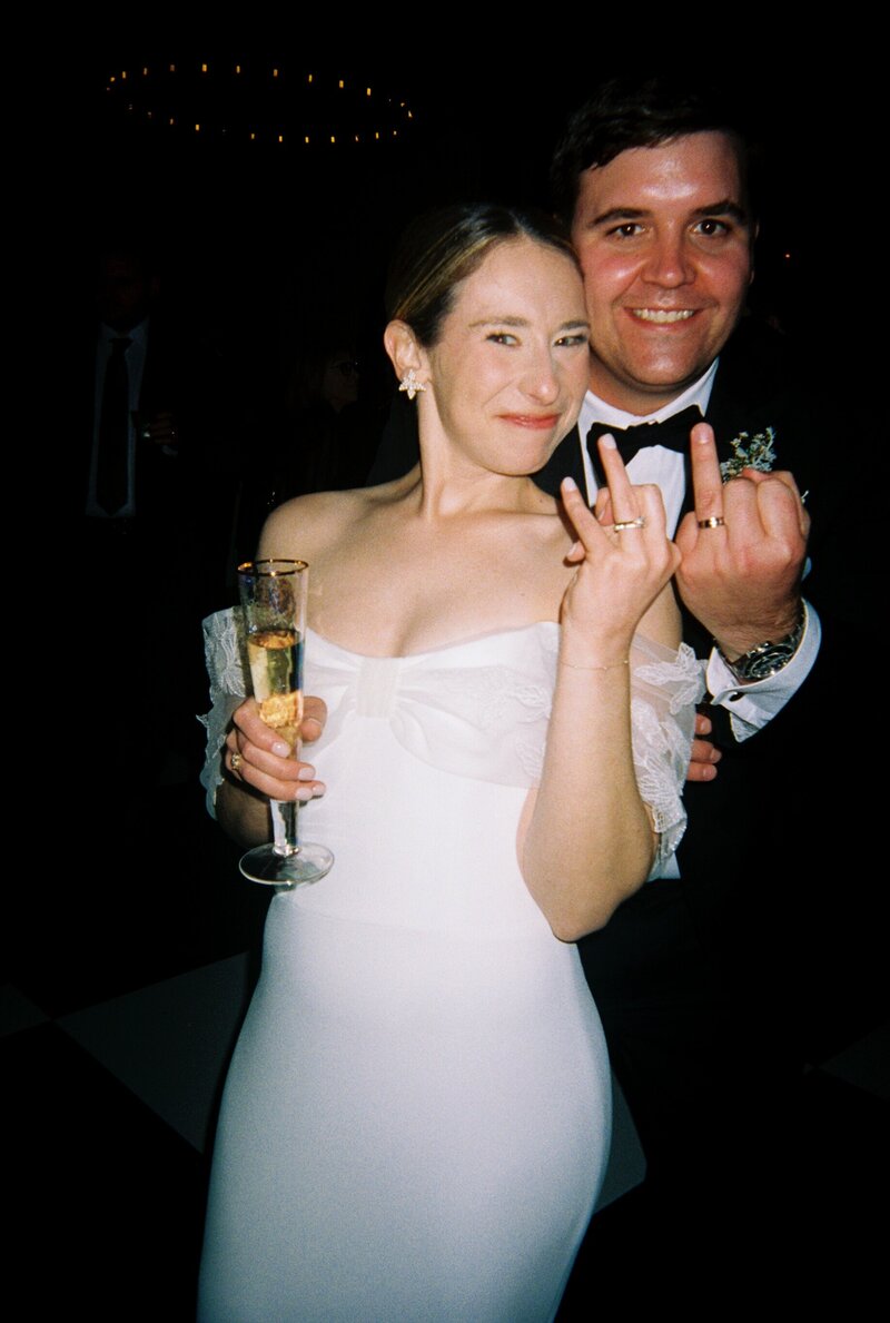 35mm film photo of bride and groom at reception showing wedding  bands