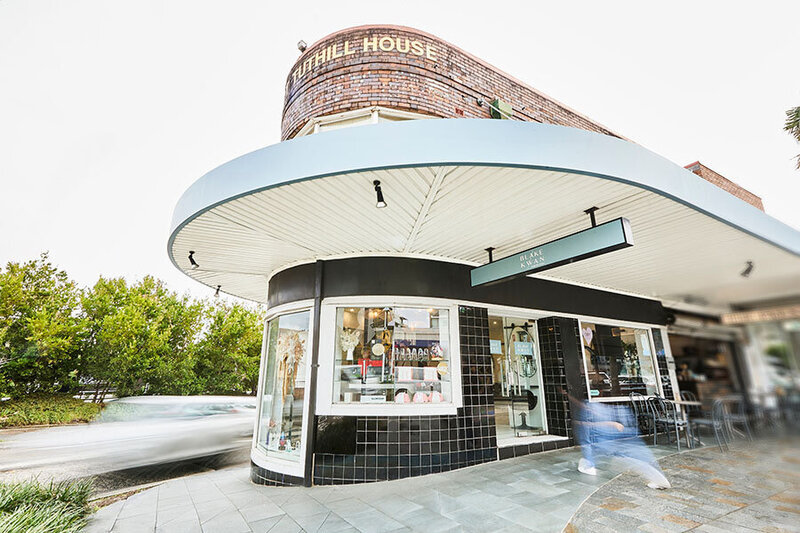 Exterior of Blake & Kwan Hair Salon in Cronulla, featuring a curved corner design and modern storefront.