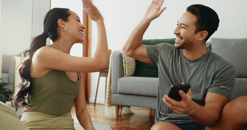 PA student couple celebrating high PANCE scores at home