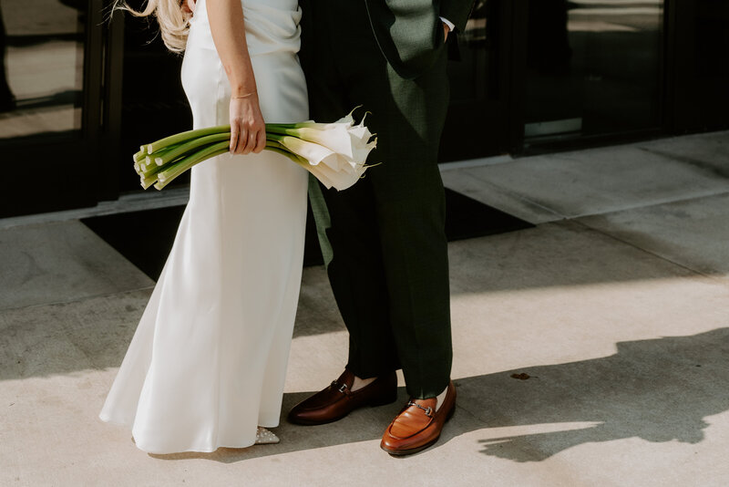 groom holding brides legs
