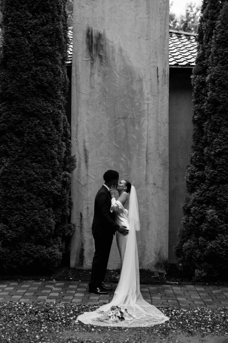 Bride and groom sharing a joyful moment by the shores of Lake Como, Italy.