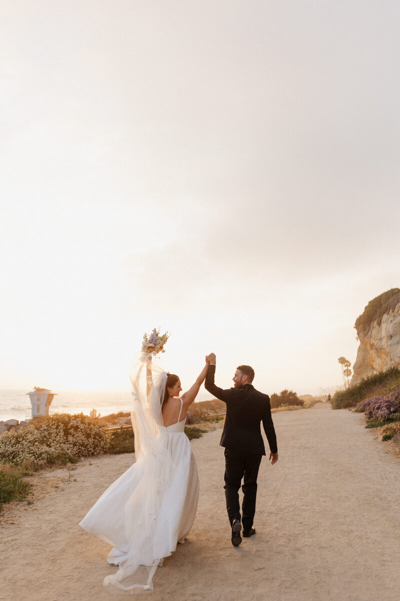 couple laughing on the beach together