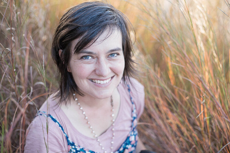 Stephanie Eddy, your Boulder Colorado wedding photographer, smiles at the camera