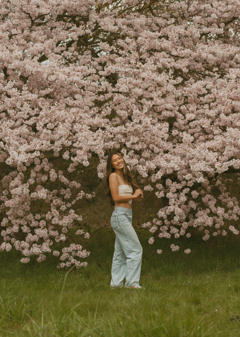 girl posing in floral dress in the forest