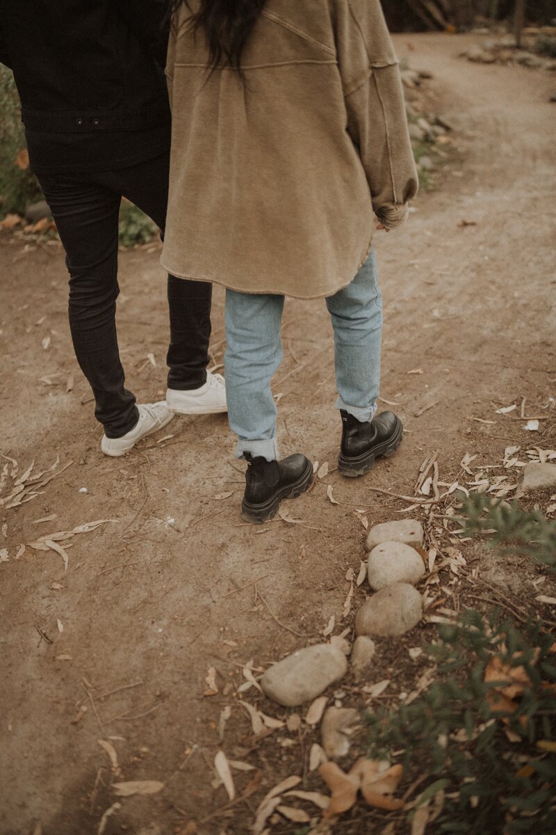 couple walking on a dirt path