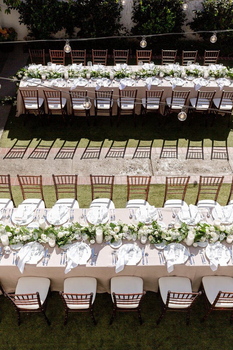 aerial view of wedding reception decor with garland on tables