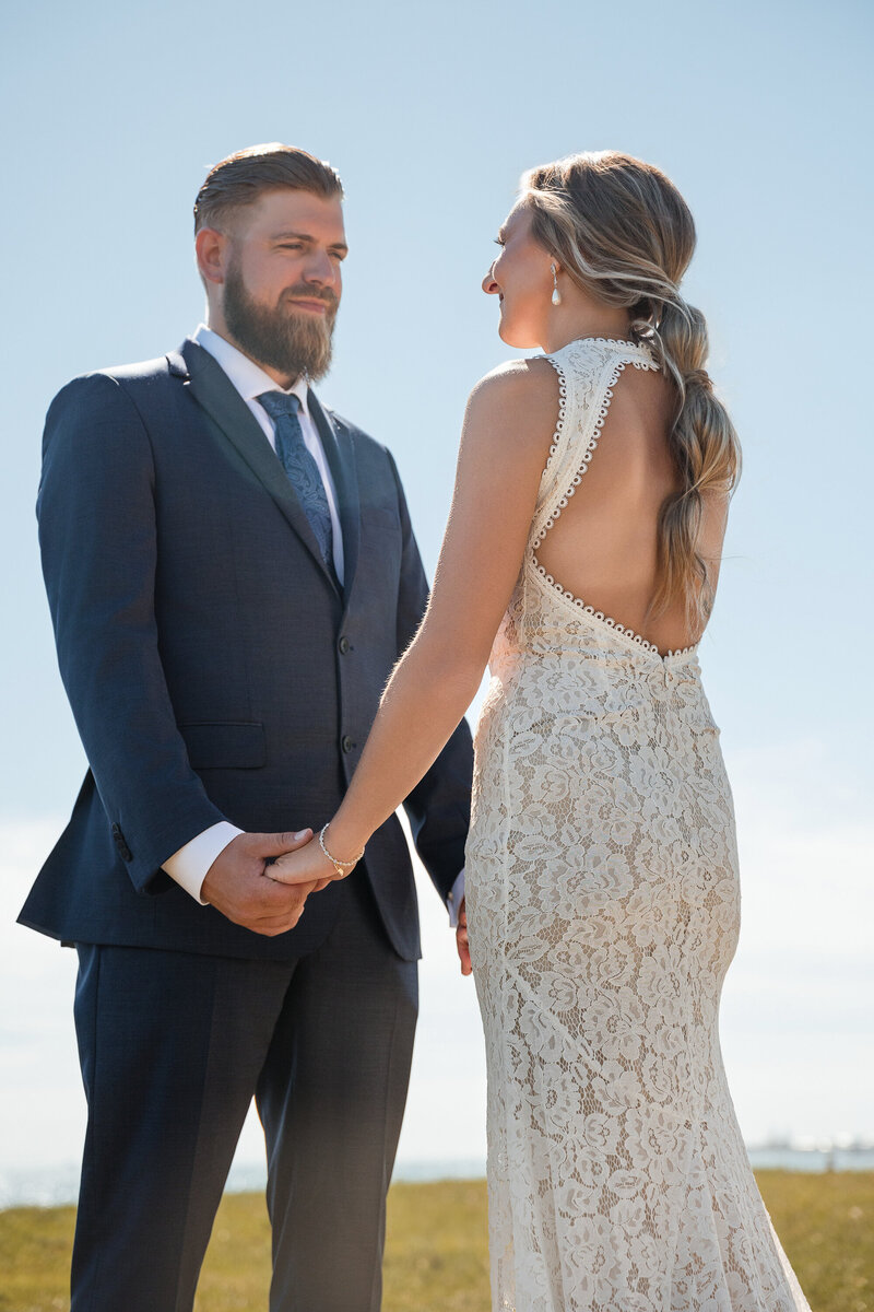 Bride laughing while holding hands with her partner at golden hour, captured by Kesha Wright Photography in Chicago.
