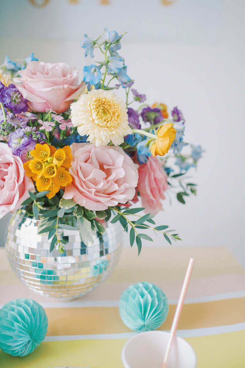 a vase with colorful flowers