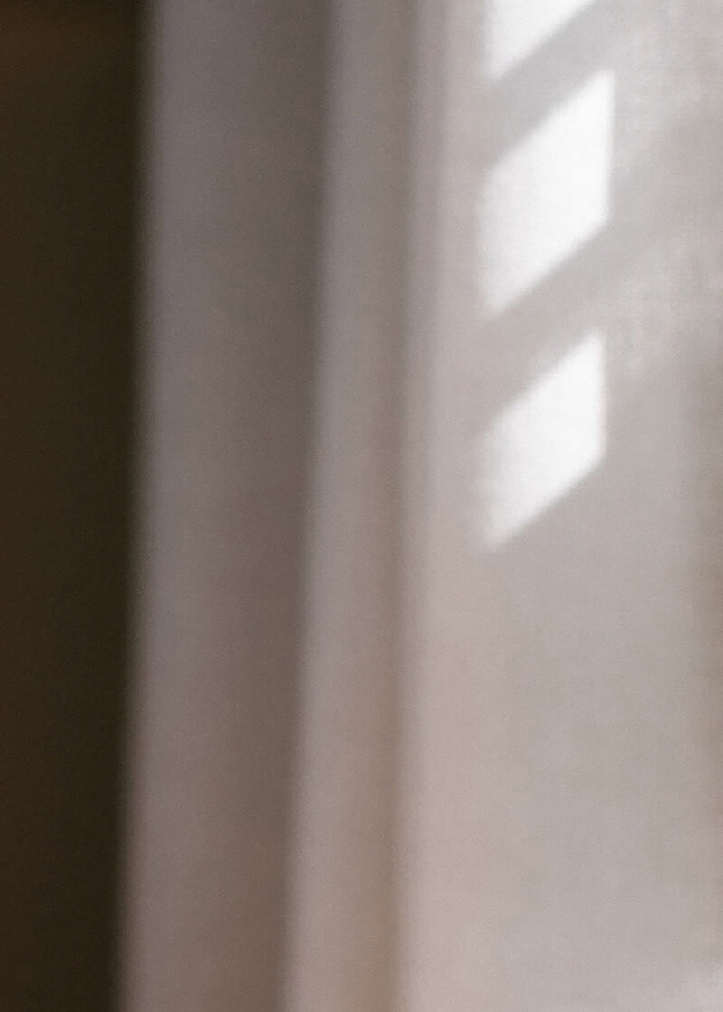 Image of a curtain on a website for therapy and coaching for moms of color